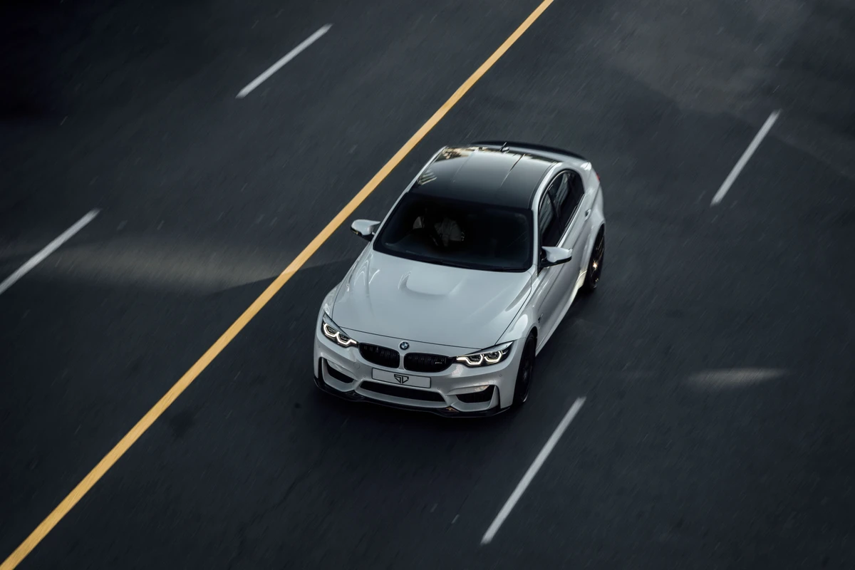 White BMW on a road