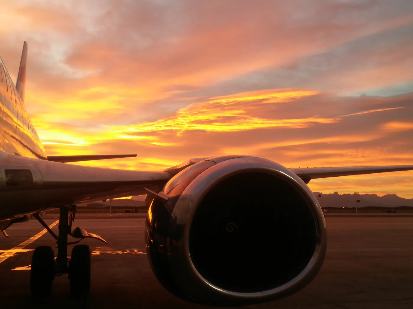An aircraft at Cape Town Airport in the light of sunset
